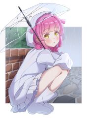  1girl absurdres ahoge blunt_bangs boots brick_wall commentary highres holding holding_umbrella long_sleeves looking_at_viewer love_live! love_live!_nijigasaki_high_school_idol_club medium_hair open_mouth outdoors pink_hair rain raincoat skirt solo squatting tennoji_rina umbrella white_boots white_raincoat white_skirt yellow_eyes yuuuta10628 