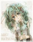  character_name detached_sleeves green_eyes green_hair hands_clasped hatsune_miku head_tilt long_hair solo vocaloid 