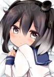  1girl bangs black_eyes black_hair blush bust close-up expressionless hair_between_eyes highres kantai_collection looking_at_viewer lying namekuzi_mame on_side school_uniform serafuku short_hair sleeves_past_wrists solo tareme tokitsukaze_(kantai_collection) 