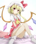  ascot bad_id bed bed_sheet between_legs blonde_hair blush bow dress flandre_scarlet footwear hand_between_legs hat highres looking_at_viewer no_shoes pen-zin pillow red_eyes ribbon short_hair side_ponytail simple_background sitting smile socks solo the_embodiment_of_scarlet_devil touhou v_arms white_background wings 