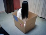  1girl black_hair box cosplay curtains dress hair_over_eyes hair_over_face in_box in_container inside long_hair palegna photo sitting solo the_ring white_dress wood yamamura_sadako 