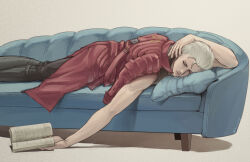  1boy arm_up black_pants black_shirt book closed_eyes closed_mouth coat commentary_request couch devil_may_cry_(series) devil_may_cry_5 hair_slicked_back highres holding holding_book ika_vergi lying male_focus on_stomach open_book pants pillow red_coat shirt sleeping solo vergil_(devil_may_cry) white_hair 
