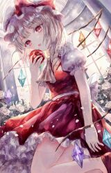  1girl absurdres apple ascot blonde_hair commentary crystal crystal_wings eating falling_petals flandre_scarlet flower food frilled_skirt frills fruit hat highres holding holding_food holding_fruit long_hair mob_cap multicolored_wings one_side_up petals puffy_short_sleeves puffy_sleeves red_eyes red_skirt red_vest rose shirt short_sleeves skirt skirt_set solo suzushina touhou vest white_flower white_hat white_petals white_rose white_shirt wings yellow_ascot 
