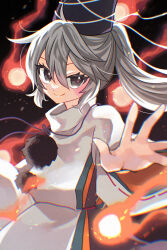  1girl absurdres black_hat blush closed_mouth commentary_request cowboy_shot embers fire foreshortening grey_eyes grey_hair hair_between_eyes hat highres japanese_clothes kariginu katsuragi_atori long_hair long_sleeves loose_hair_strand mononobe_no_futo pom_pom_(clothes) ponytail ribbon-trimmed_sleeves ribbon_trim smile solo tate_eboshi touhou turtleneck wide_sleeves 