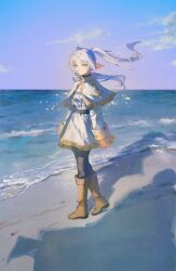  1girl beach belt black_belt black_pantyhose boots breasts brown_boots capelet closed_mouth dress earrings elf floating_earrings frieren green_eyes grey_hair highres jewelry long_hair long_sleeves looking_at_viewer ocean outdoors pantyhose parted_bangs pointy_ears quasarcake sky solo sousou_no_frieren teardrop_earrings twintails water white_capelet white_hair 