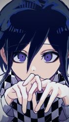  1boy black_hair checkered_clothes checkered_scarf close-up commentary_request danganronpa_(series) danganronpa_v3:_killing_harmony flipped_hair hair_between_eyes hands_up highres interlocked_fingers light_smile long_sleeves looking_at_viewer male_focus oguma_(ogm) oma_kokichi portrait purple_hair scarf short_hair simple_background solo staring two-tone_scarf violet_eyes 