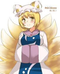  1girl absurdres animal_hat arms_under_breasts blonde_hair blue_tabard blush breasts closed_mouth commentary_request dated dress fox_tail hands_in_opposite_sleeves hat highres kazari_s kitsune large_breasts looking_at_viewer mob_cap multiple_tails short_hair simple_background smile solo tabard tail touhou twitter_username white_background white_dress white_hat yakumo_ran yellow_eyes 
