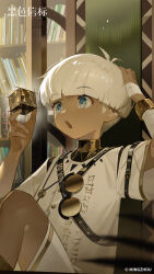  1boy :o absurdres black_beacon blue_eyes book bookshelf copyright_name copyright_notice dark-skinned_male dark_skin enki_(black_beacon) hand_on_own_head hands_up highres holding_cube indoors knee_up logo looking_at_object male_focus official_art official_wallpaper round_eyewear shirt shorts sitting solo unworn_eyewear upper_body white_hair white_shirt white_shorts 
