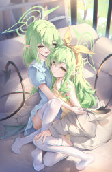  2girls absurdres blue_archive commentary_request couch fang green_hair hair_between_eyes halo highres hikari_(blue_archive) indoors knee_up long_hair multiple_girls norimori nozomi_(blue_archive) on_one_knee open_mouth pajamas parted_lips pointy_ears short_sleeves siblings sisters sleeveless smile tail thigh-highs twins white_thighhighs yellow_eyes 