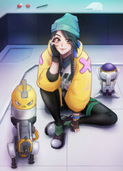  1girl aqua_hat beanie black_gloves black_hair black_pants blush brown_eyes closed_mouth commentary english_commentary eyelashes fingerless_gloves full_body gloves green_shoes hair_over_one_eye hand_on_own_face hat head_rest highres indoors jacket killjoy_(valorant) lips long_hair long_sleeves open_clothes open_jacket pants paper shirt shoes sitting smile solo valorant white_shirt yellow_jacket zukidesu 