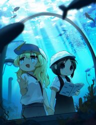  2girls absurdres ahoge animal_print aquarium_tunnel baseball_cap black_hair blonde_hair book bucket_hat chito_(shoujo_shuumatsu_ryokou) denim fish fish_print hat highres holding holding_book holding_hands jeans karmanimaxwx long_hair multiple_girls pants shirt shoujo_shuumatsu_ryokou smile sunlight white_shirt yuuri_(shoujo_shuumatsu_ryokou) 