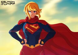  1girl absurdres artist_name blonde_hair blue_bodysuit blue_eyes bodysuit breasts cape dc_comics hands_on_own_hips highres my_adventures_with_superman red_cape salmonjumpp short_hair short_hair_with_long_locks skirt smile supergirl supergirl_(my_adventures_with_superman) superhero_costume superman_(series) superman_logo 