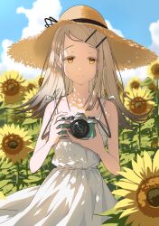  1girl absurdres blonde_hair blue_sky camera closed_mouth clouds colored_eyelashes commentary_request day dress field flipped_hair flower flower_field gakuen_idolmaster hair_ornament hairclip hat highres holding holding_camera idolmaster looking_at_viewer orange_eyes outdoors parallel_hairclips same_same_shark shinosawa_hiro sky smile solo straight-on straw_hat sun_hat sundress sunflower sunflower_field upper_body white_dress 