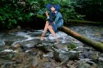  backpack bag blue_eyes blue_hair feet_in_water forest hair_bobbles hair_ornament hat kawashiro_nitori looking_at_viewer nature river rock shirt sitting skirt skirt_set sleeves_pushed_up soaking_feet solo touhou tree twintails water wtuw 