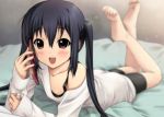  :d barefoot bike_shorts black_hair blurry blush brown_eyes cellphone depth_of_field feet highres k-on! legs_up long_hair looking_at_viewer lying nakano_azusa off_shoulder on_stomach open_mouth phone ryunnu sleeves_past_wrists smile soles solo sweater sweater_dress toes twintails 