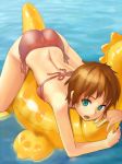 1girl aqua_eyes ass bikini brown_hair copyright_request inflatable_toy on_stomach open_mouth side-tie_bikini solo sumi_(sichirin) swimsuit water 