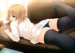  1girl absurdres ass black_legwear blonde_hair blue_eyes blue_panties coffee-kizoku cookie copyright_request female food highres looking_back lying mouth_hold on_stomach panties scan solo thigh-highs thighhighs underwear 
