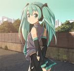  1girl detached_sleeves domo1220 green_eyes green_hair hatsune_miku headphones long_hair looking_back necktie skirt smile solo twintails vocaloid 