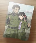 1girl age_difference beard black_hair brown_eyes cigarette claus_(sora_no_woto) facial_hair fingerless_gloves gloves hair_ribbon hand_on_shoulder height_difference highres military military_uniform orz_(orz57) photo_(object) pose ribbon short_hair short_twintails sora_no_woto suminoya_kureha twintails uniform waving wink 