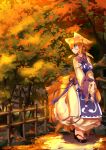  animal_ears blonde_hair blue_eyes breast_squeeze breasts clog_sandals dress fence fox_ears fox_tail hat hat_removed hat_with_ears headwear_removed highres koha large_breasts long_sleeves multiple_tails solo sunset tabard tail touhou tree turning v_arms white_dress wide_sleeves yakumo_ran 