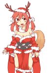  1girl adapted_costume antlers bare_shoulders blush_stickers breasts caster_(fate/extra) cleavage detached_sleeves dress fate/extra fate_(series) fox_tail hat highres kneehighs pink_hair popl santa_costume santa_hat sash smile solo strapless_dress tail yellow_eyes 