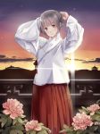  arms_up blush chinese_clothes flower grey_eyes hair_ribbon holding japanese_clothes looking_at_viewer miko original pvmivs ribbon silver_eyes silver_hair smile solo sunlight 