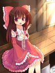  1girl adapted_costume bow breasts brown_hair chiri_(tiri0401) cleavage detached_sleeves door dress hair_bow hair_tubes hakurei_reimu light open_mouth outdoors red_eyes sitting smile solo touhou 