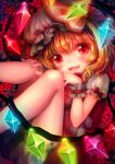  1girl blonde_hair bloomers blush curled_up dress fangs flandre_scarlet glowing glowing_wings hand_on_knee hat hat_ribbon looking_at_viewer nishiki_koi open_mouth puffy_sleeves red_dress red_eyes ribbon short_sleeves smile solo touhou underwear wings wrist_cuffs 