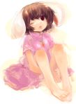  1girl animal_ears bare_legs barefoot brown_eyes brown_hair carrot dress highres inaba_tewi jewelry maccha_cocoa necklace open_mouth pendant pink_dress rabbit_ears short_hair sitting solo touhou wink 