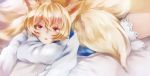  1girl animal_ears bed blonde_hair fox_ears fox_tail hat hat_removed headwear_removed looking_at_viewer lying on_stomach pillow short_hair solo surumeri_(baneiro) tail touhou yakumo_ran yellow_eyes 